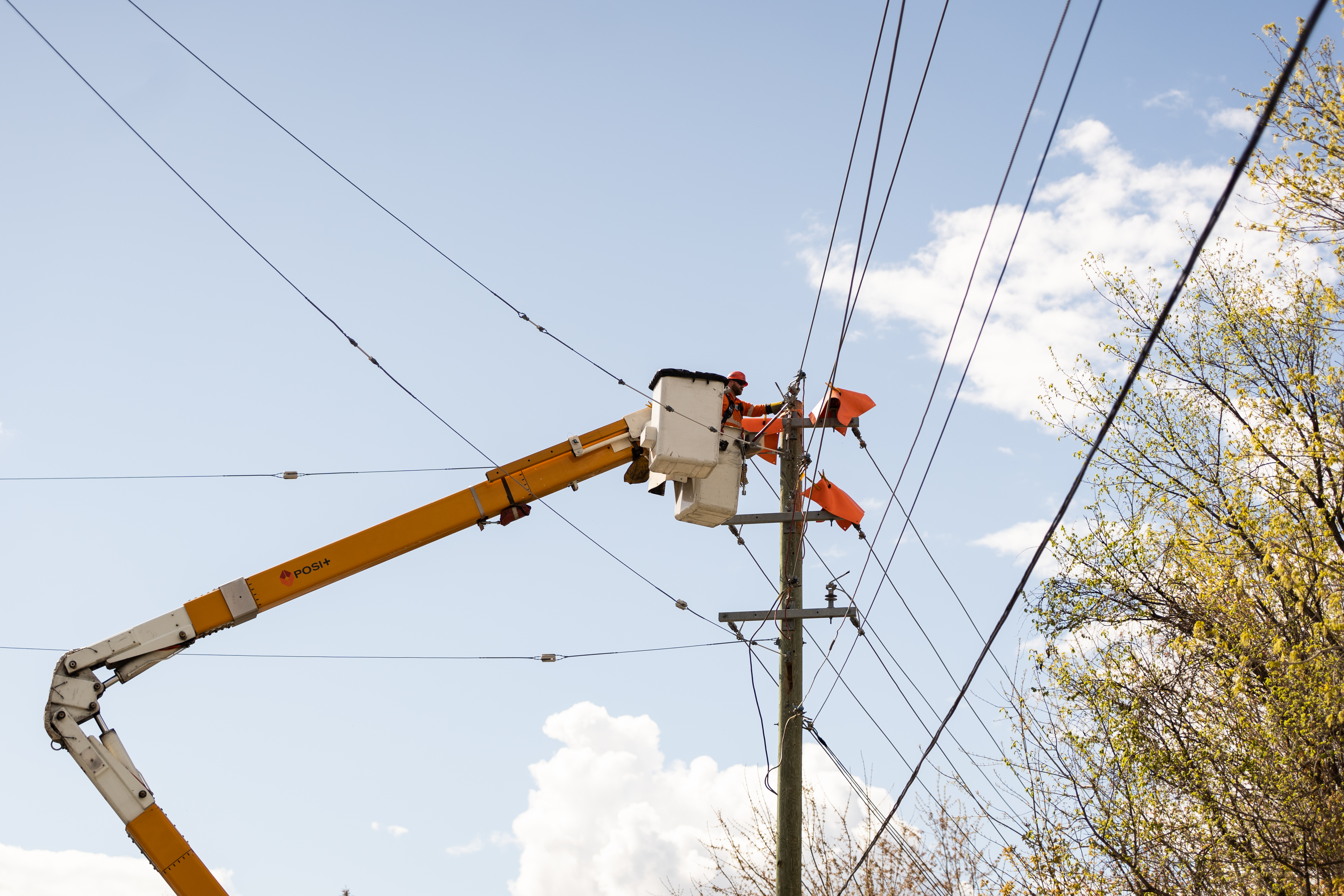 Power line worker in a bucket truck