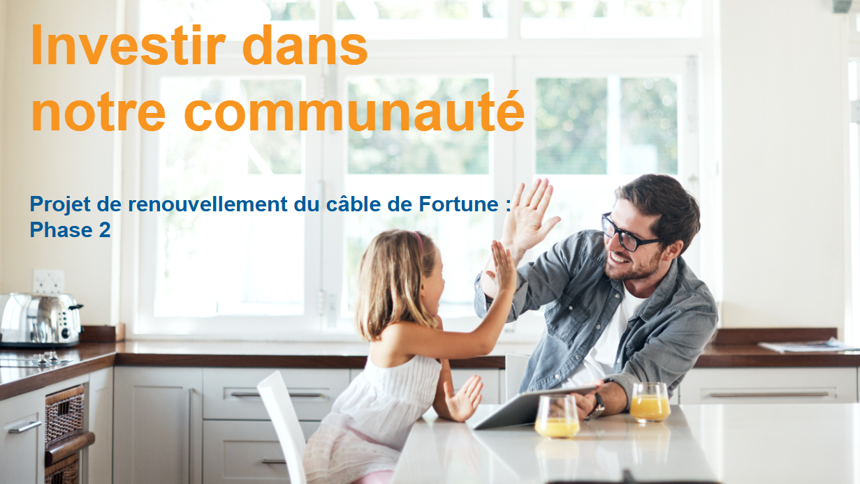 image showing a young child and her father high-fiving in their kitchen.