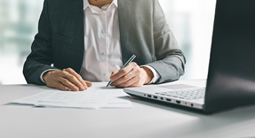 business man at desk with laptop