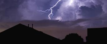 Lightning strike in a dark neighbourhood during a power outage