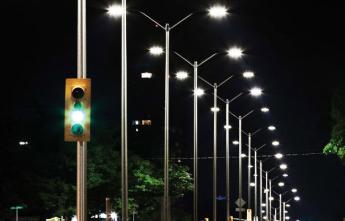 Traffic light with streetlights in the background