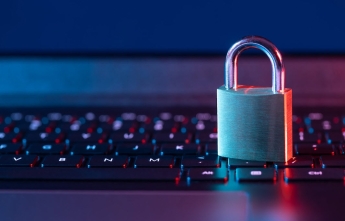 A padlock rests on a computer keyboard