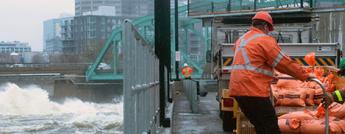 Hydro Ottawa employees working on sandbags for the Flooding 2019