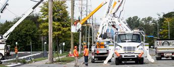 Hydro Ottawa power line maintainer in an aerial bucket