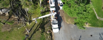 Aerial image of hydro bucket truck working on overheads lines