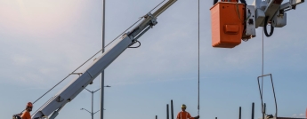 Hydro workers performing various duties on a sunny day